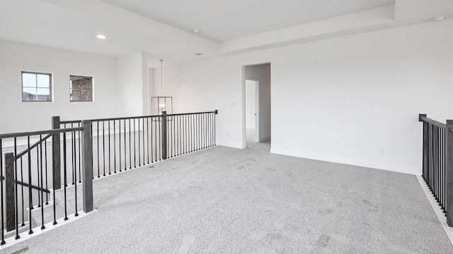 702 Bay Breeze Dr, Kyle, TX 78640 - spare room with carpet floors, recessed lighting, and a raised ceiling