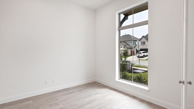 702 Bay Breeze Dr, Kyle, TX 78640 - unfurnished room with light wood-style floors