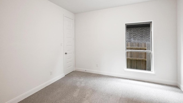 702 Bay Breeze Dr, Kyle, TX 78640 - carpeted spare room with baseboards