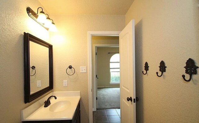 503 W Gemini Ln, Killeen, TX 76542 - bathroom with vanity, tile patterned flooring, and a textured wall