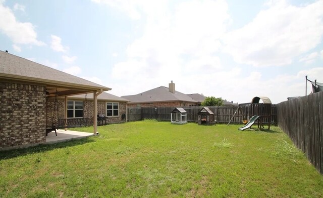 503 W Gemini Ln, Killeen, TX 76542 - fenced backyard with a playground and a patio area