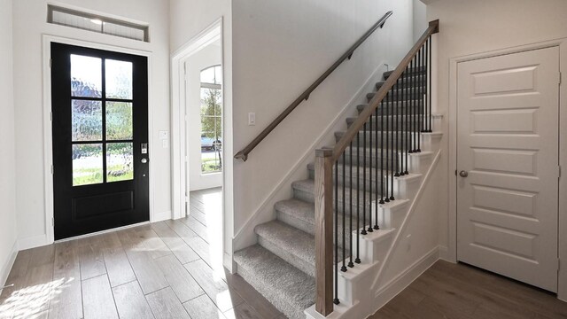 657 Bay Breeze Dr, Kyle, TX 78640 - foyer entrance featuring wood finished floors and stairway