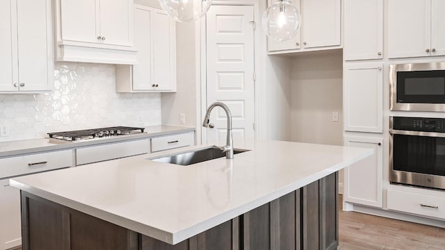 657 Bay Breeze Dr, Kyle, TX 78640 - kitchen featuring stainless steel appliances, white cabinets, and light countertops
