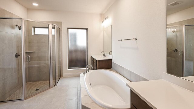 657 Bay Breeze Dr, Kyle, TX 78640 - full bath with a shower stall, a bath, vanity, and tile patterned flooring