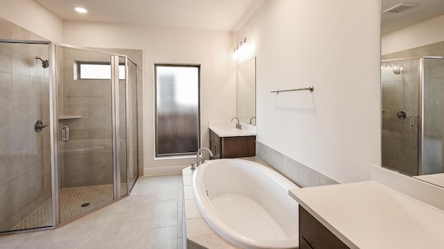 657 Bay Breeze Dr, Kyle, TX 78640 - full bathroom featuring a shower stall, a bath, vanity, and tile patterned flooring
