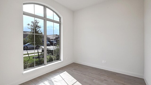 657 Bay Breeze Dr, Kyle, TX 78640 - spare room with wood finished floors and baseboards