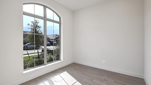 657 Bay Breeze Dr, Kyle, TX 78640 - unfurnished room with wood finished floors and baseboards
