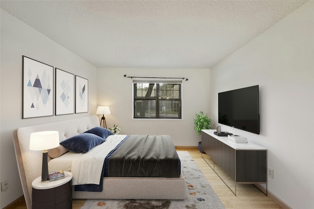 8210 Bent Tree Rd Unit 115, Austin, TX 78759 - bedroom with a textured ceiling and light wood-style flooring