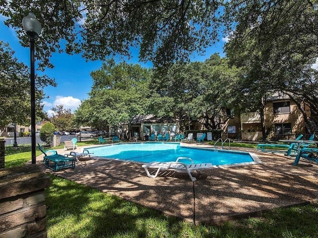 8210 Bent Tree Rd Unit 115, Austin, TX 78759 - community pool featuring a patio area