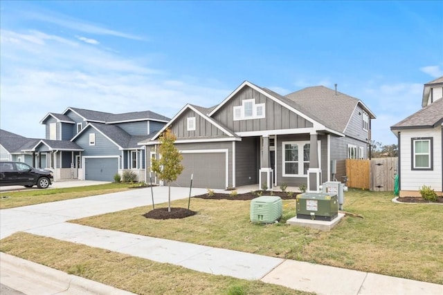 craftsman inspired home featuring fence, concrete driveway, a residential view, board and batten siding, and a front yard