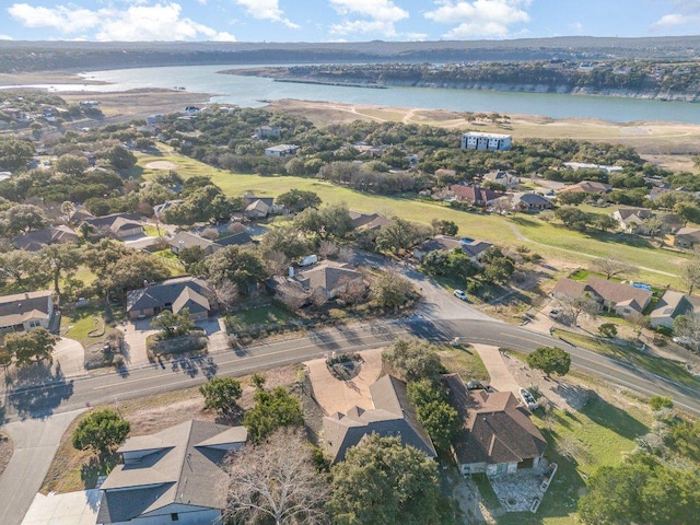 drone / aerial view with a residential view and a water view