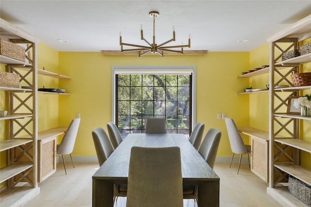 4704 Wild Briar Pass, Austin, TX 78746 - dining space with wood finished floors, baseboards, and a chandelier