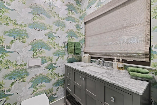 4704 Wild Briar Pass, Austin, TX 78746 - half bathroom featuring wallpapered walls, vanity, and toilet
