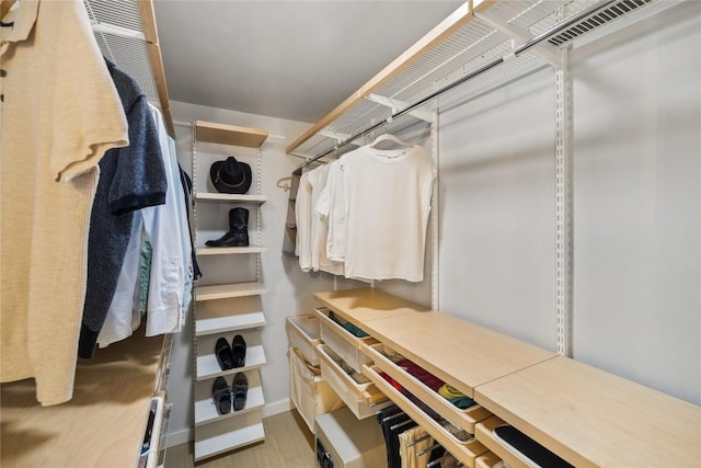 4704 Wild Briar Pass, Austin, TX 78746 - walk in closet featuring wood finished floors