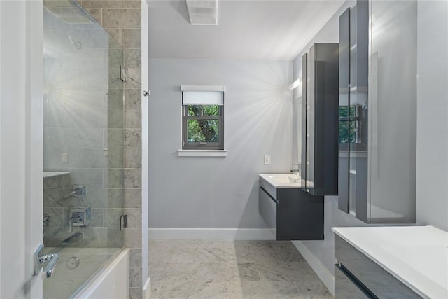 4704 Wild Briar Pass, Austin, TX 78746 - bathroom featuring vanity, baseboards, enclosed tub / shower combo, and marble finish floors
