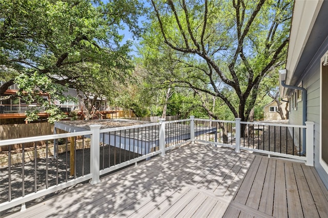 4704 Wild Briar Pass, Austin, TX 78746 - wooden deck featuring a fenced backyard