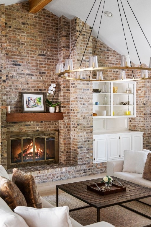 4704 Wild Briar Pass, Austin, TX 78746 - living area with brick wall, high vaulted ceiling, and a brick fireplace