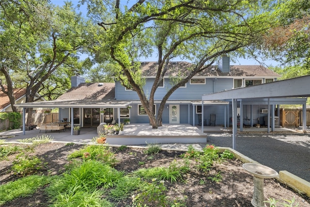 4704 Wild Briar Pass, Austin, TX 78746 - back of house with a chimney, a patio area, and a deck