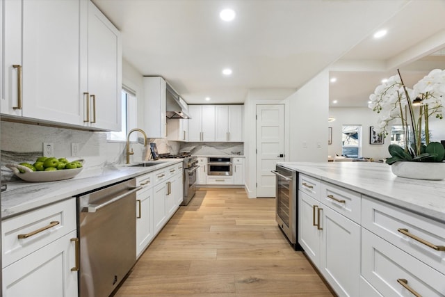 kitchen featuring appliances with stainless steel finishes and white cabinets