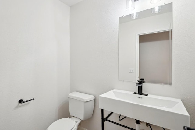 114 Challenger, Kyle, TX 78640 - half bath featuring toilet and a sink