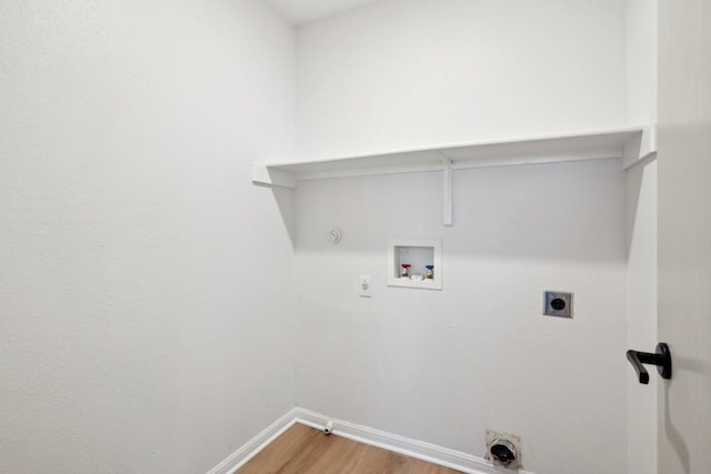 114 Challenger, Kyle, TX 78640 - laundry area featuring hookup for an electric dryer, hookup for a gas dryer, baseboards, light wood-style floors, and hookup for a washing machine