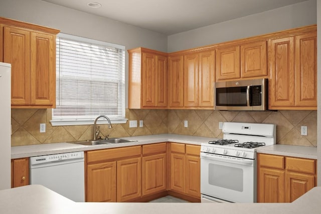 19907 Kennemer Dr, Pflugerville, TX 78660 - kitchen featuring white appliances, light countertops, and decorative backsplash