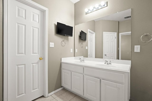 19907 Kennemer Dr, Pflugerville, TX 78660 - full bathroom featuring double vanity and tile patterned floors