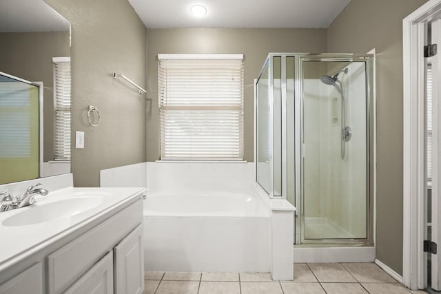 19907 Kennemer Dr, Pflugerville, TX 78660 - full bath with a stall shower, a bath, vanity, and tile patterned floors