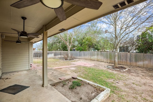 19907 Kennemer Dr, Pflugerville, TX 78660 - fenced backyard with a ceiling fan and a patio area