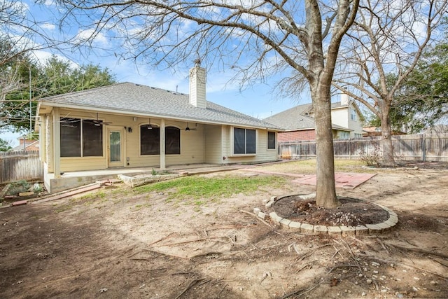 19907 Kennemer Dr, Pflugerville, TX 78660 - rear view of house featuring ceiling fan, a chimney, a shingled roof, and a patio area