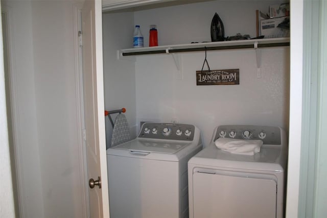 washroom with washer and clothes dryer