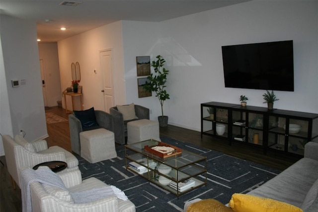 living area featuring visible vents, dark wood-style flooring, and recessed lighting