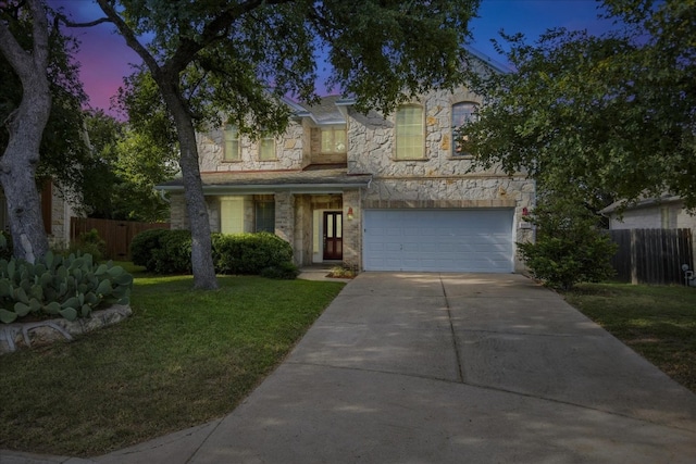6205 York Bridge Cir, Austin, TX 78749 - view of front of home featuring driveway, a garage, and stone siding