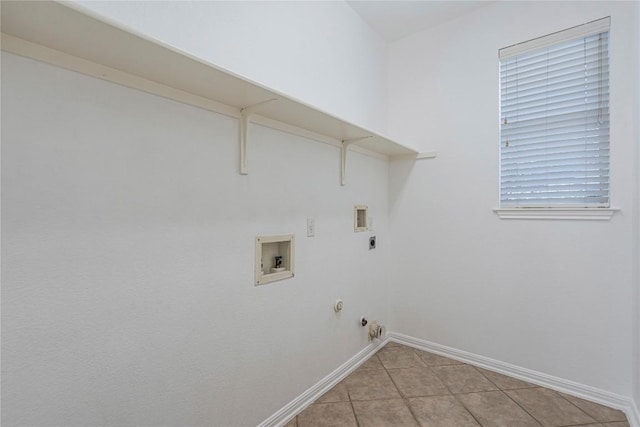 6205 York Bridge Cir, Austin, TX 78749 - laundry room featuring hookup for a gas dryer, washer hookup, baseboards, and light tile patterned flooring