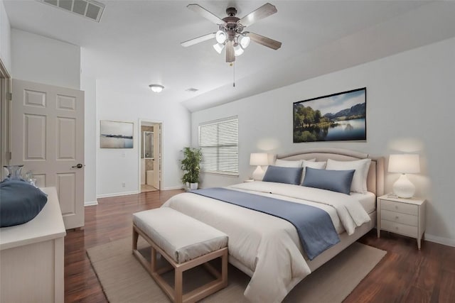 bedroom featuring dark wood-style flooring, visible vents, connected bathroom, ceiling fan, and baseboards