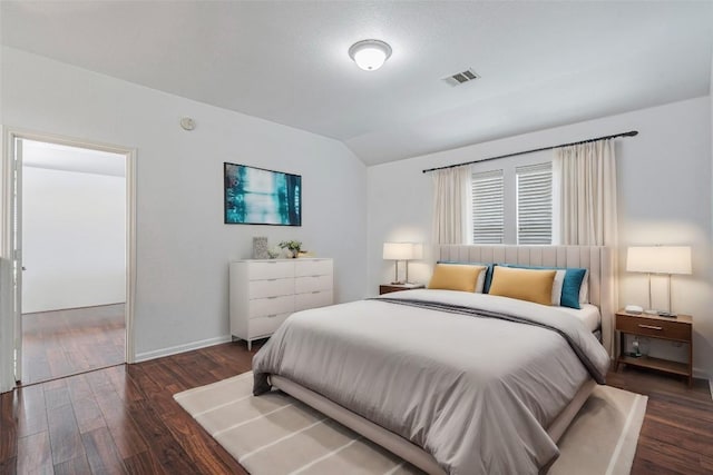 6205 York Bridge Cir, Austin, TX 78749 - bedroom featuring lofted ceiling, wood finished floors, and baseboards