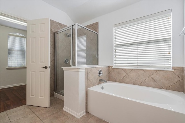 6205 York Bridge Cir, Austin, TX 78749 - bathroom with a garden tub, a stall shower, tile patterned floors, and vaulted ceiling