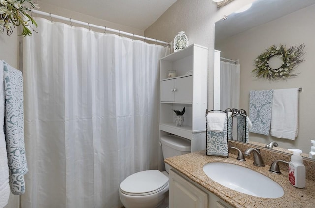 full bathroom with vanity and toilet