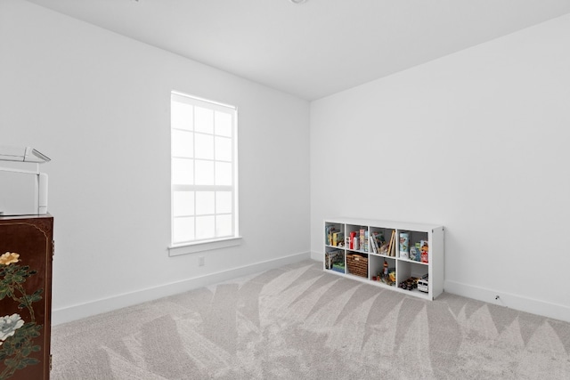 rec room featuring a healthy amount of sunlight, carpet flooring, and baseboards