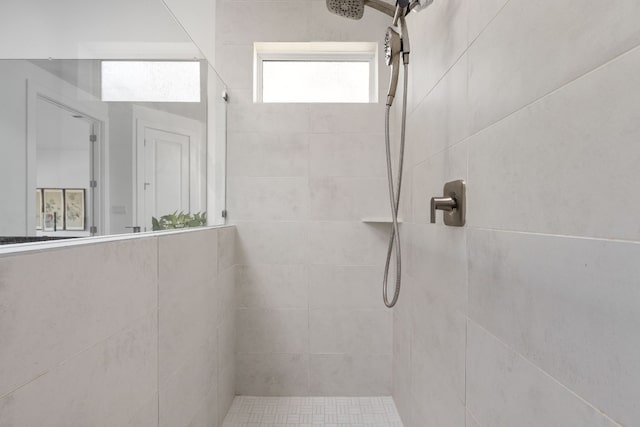 full bath featuring a tile shower