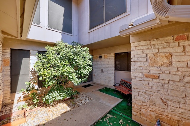 11512 Tin Cup Dr Unit 211, Austin, TX 78750 - entrance to property featuring stone siding