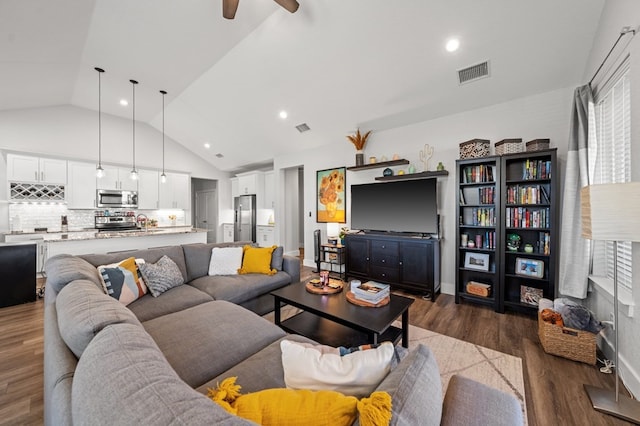 living area with recessed lighting, dark wood-style flooring, and visible vents