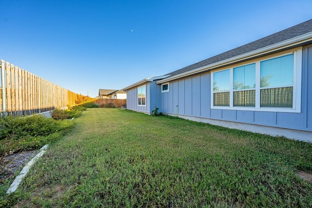 view of yard with a fenced backyard