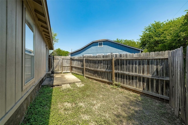 view of yard with a fenced backyard and a patio