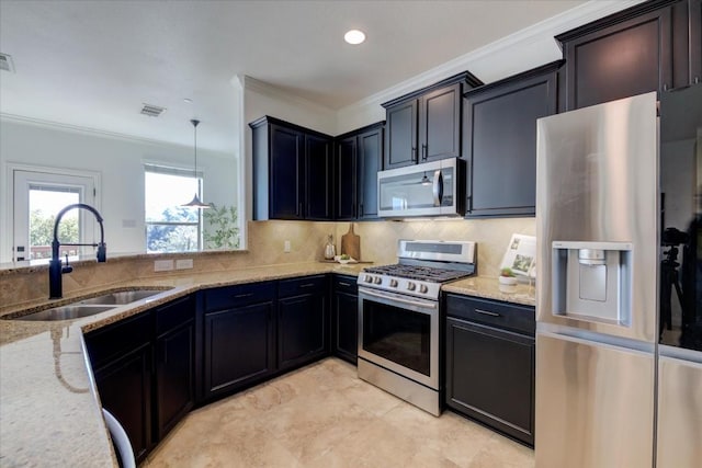 kitchen with ornamental molding, appliances with stainless steel finishes, light stone counters, decorative light fixtures, and a sink