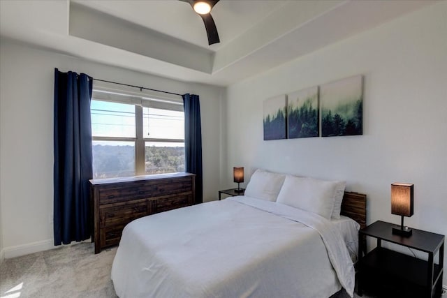 700 Mandarin Flyway Dr Unit 1702, Cedar Park, TX 78613 - bedroom featuring light colored carpet, a tray ceiling, baseboards, and ceiling fan