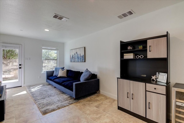 700 Mandarin Flyway Dr Unit 1702, Cedar Park, TX 78613 - living area with beverage cooler, baseboards, light tile patterned floors, and recessed lighting