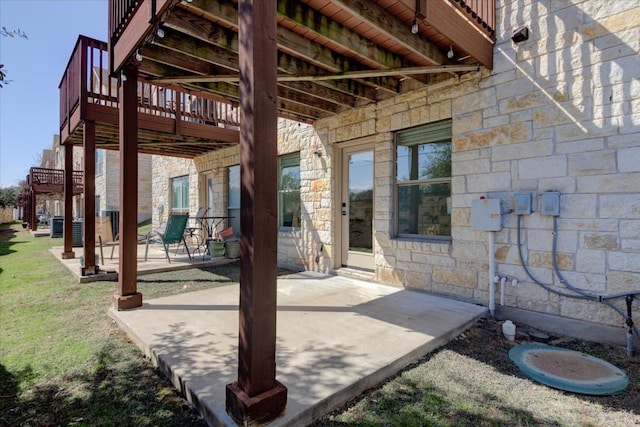 view of patio / terrace with stairs and a deck