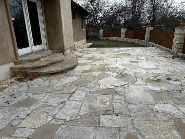 view of patio / terrace with entry steps and fence