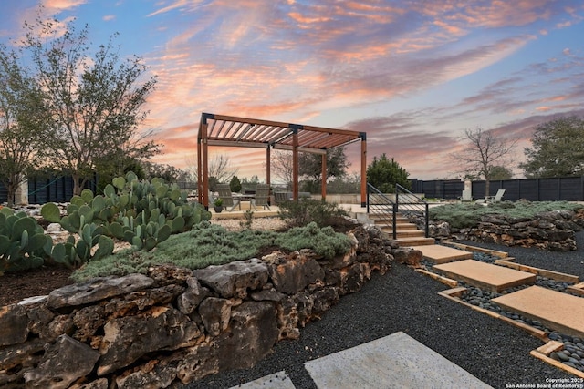 5922 Keller Rdg, New Braunfels, TX 78132 - yard at dusk featuring a pergola and a patio